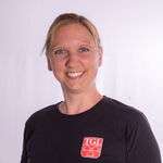 Ein Mann mit Brille und weißem Hemd, Mitglied der Turngemeinde Landshut, lächelt freundlich in die Kamera.